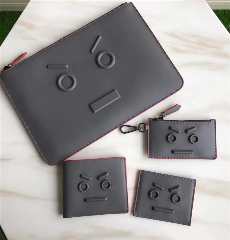 0076 FENDI 芬迪 face浮雕同色貼花 小牛皮 纖薄手拿包 灰色